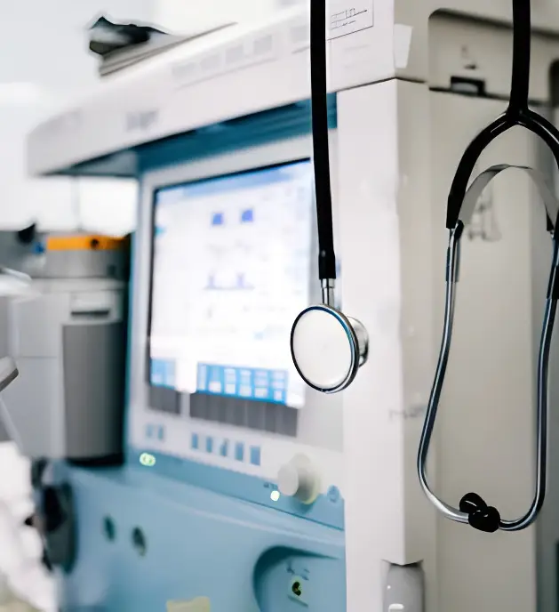 A close-up view of a medical ventilator machine with a stethoscope hanging from it, representing the critical medical instruments that benefit from ARKA's PVD coatings for enhanced precision and reliability.