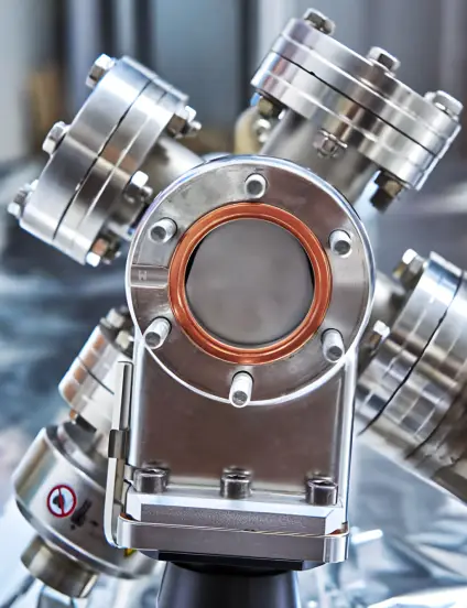 Two PVD-coated piston rods and pistons, precision components that benefit from ARKA's TASC multi-functional coating for enhanced performance and durability.