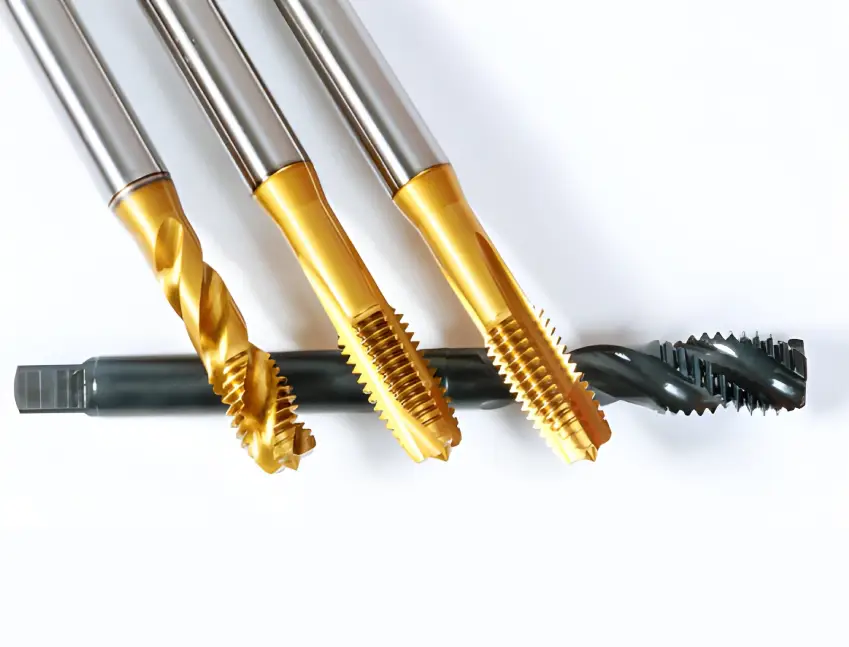 A collection of PVD-coated taps and a threading tool, showcasing the gold and dark finishes that reduce torque and prevent galling for cleaner threads.