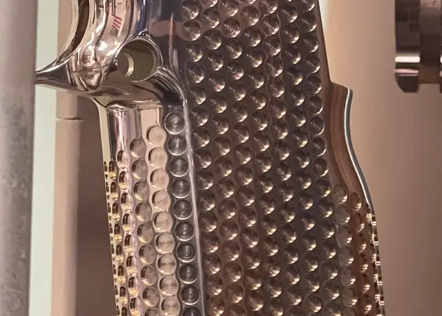 A close-up of a bronze PVD-coated golf putter head with a clean, smooth finish, highlighting the durability and aesthetic appeal of the coating.