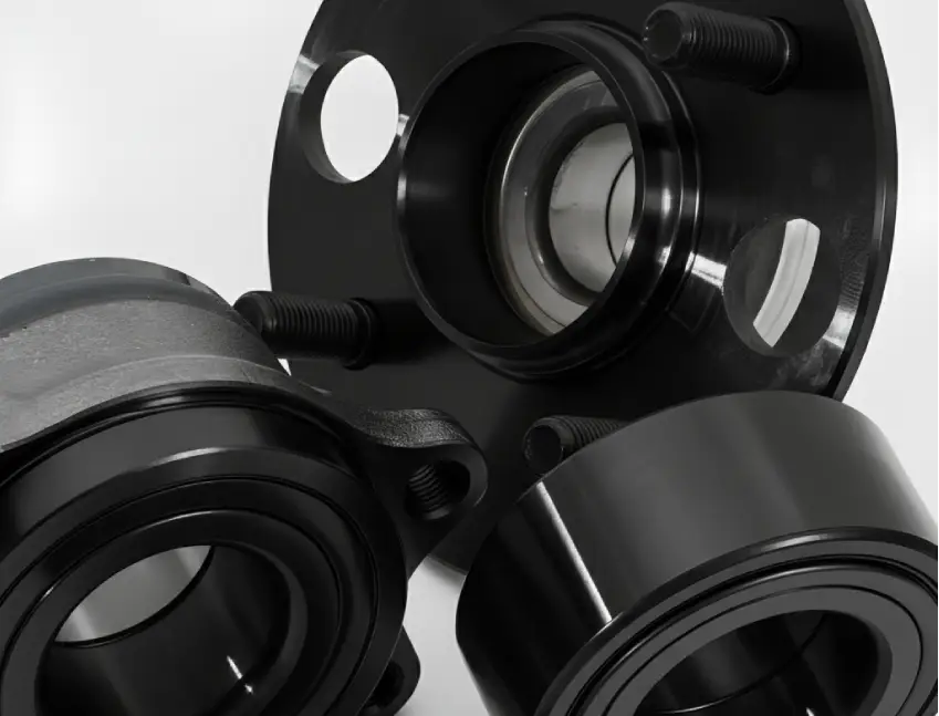 A set of automotive wheel bearings and hub assemblies with a deep black Diamond-Like Carbon (DLC) PVD coating, representing a hard, carbon-based film for very low friction and enhanced durability.